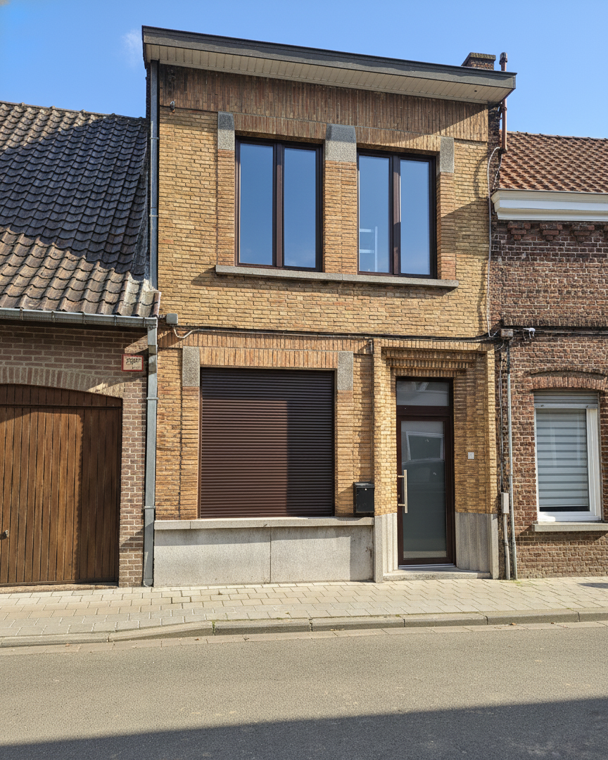 Street view of the renewed façade with matching joinery and roller shutter